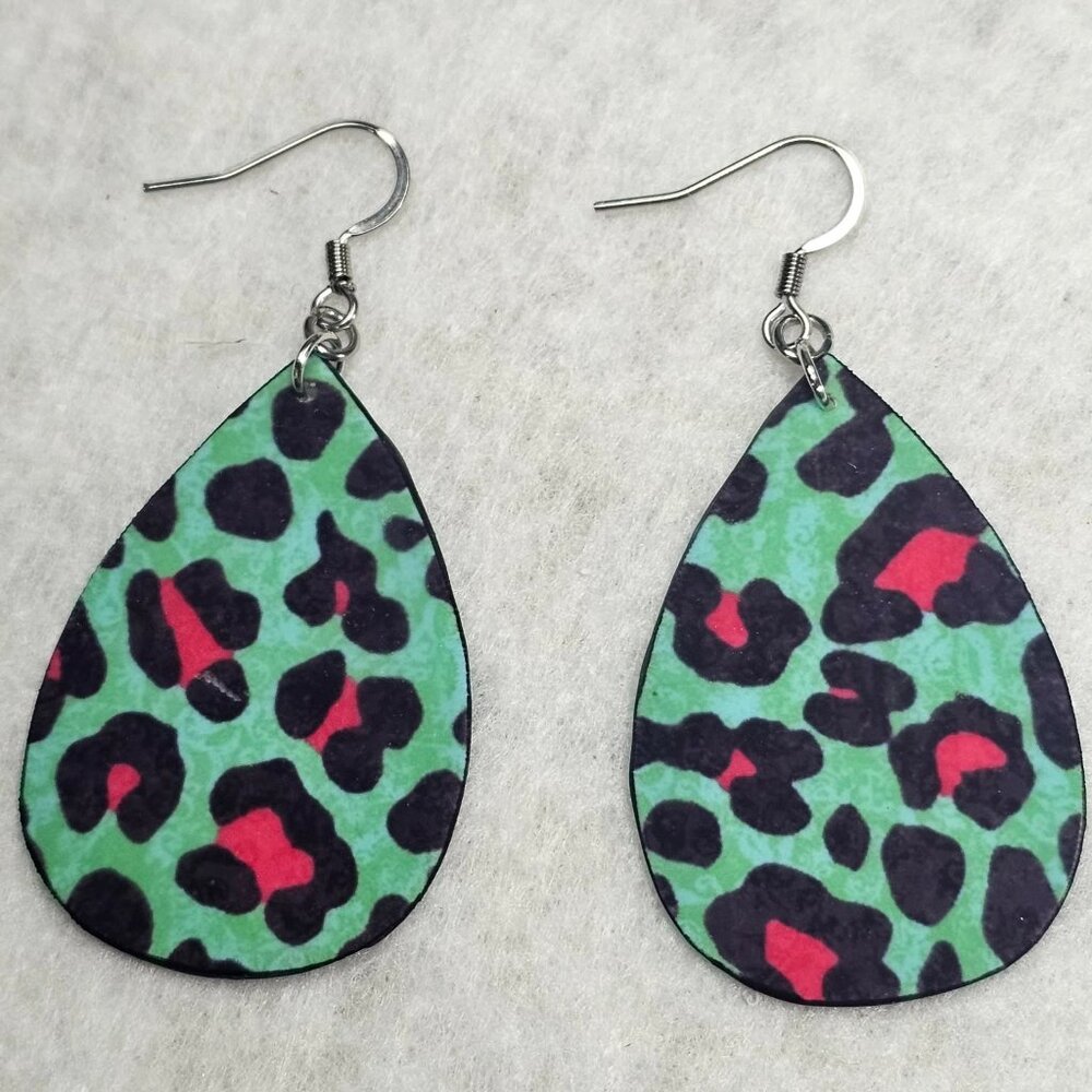 Handmade teardrop earrings with a teal and hot pink leopard print on both sides